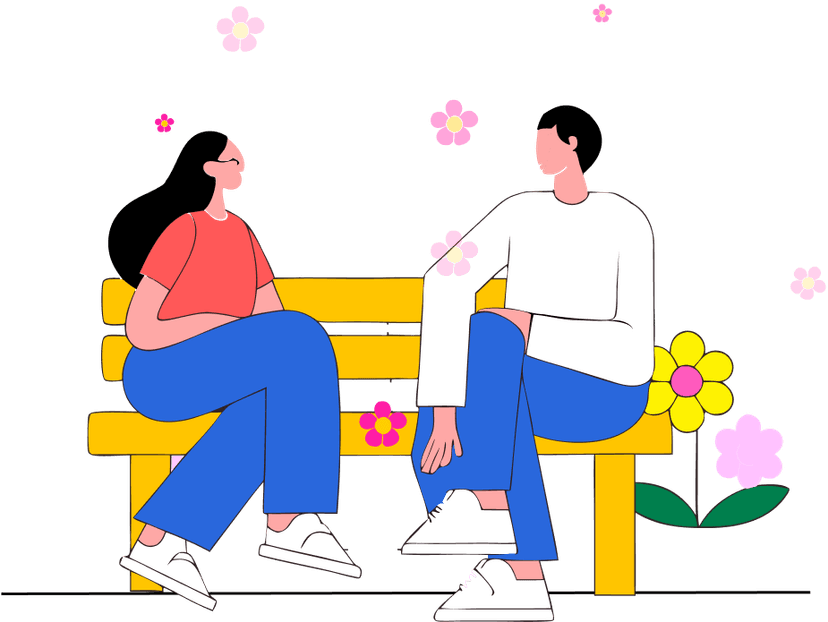 Couple sitting on a bench with flowers